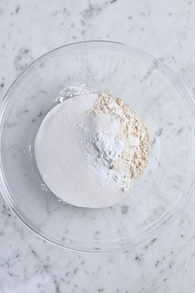 All-purpose flour, granulated sugar, baking powder, baking soda, and salt in large glass bowl
