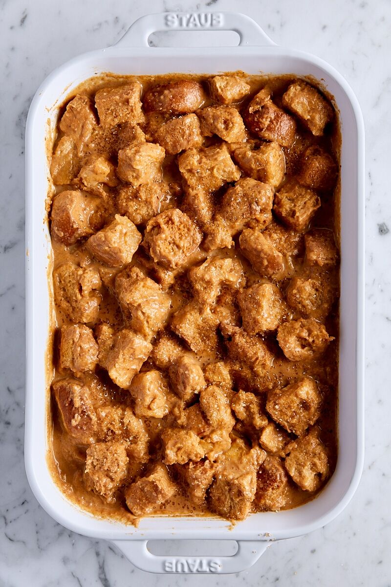 Unbaked pumpkin bread pudding sprinkled with coarse sugar