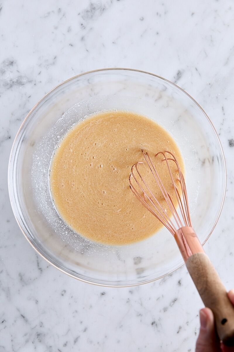Wet ingredients whisked together in glass bowl