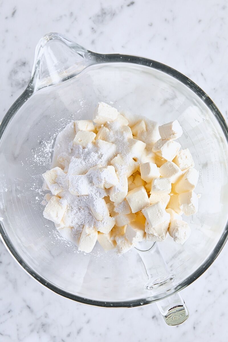 Room temperature cream cheese, granulated sugar, arrowroot starch, and salt in glass mixing bowl