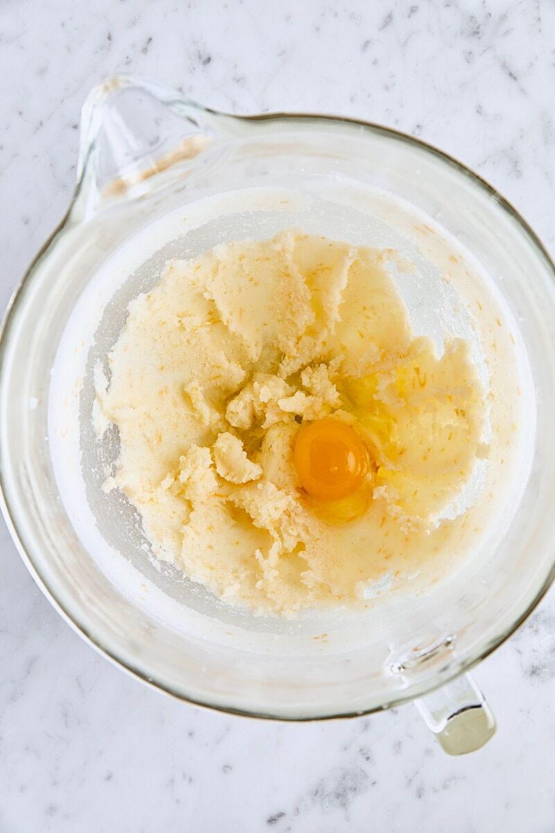 Egg added to batter in glass mixer bowl