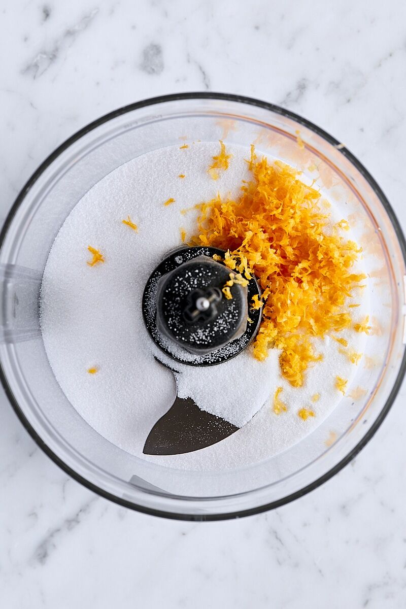 Lemon zest and granulated sugar in food processor