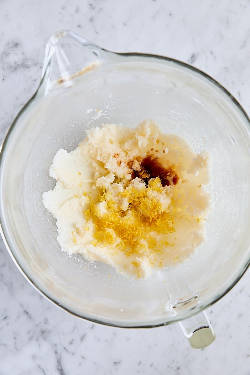 Fresh lemon zest and vanilla extract added to creamed sugar mixture