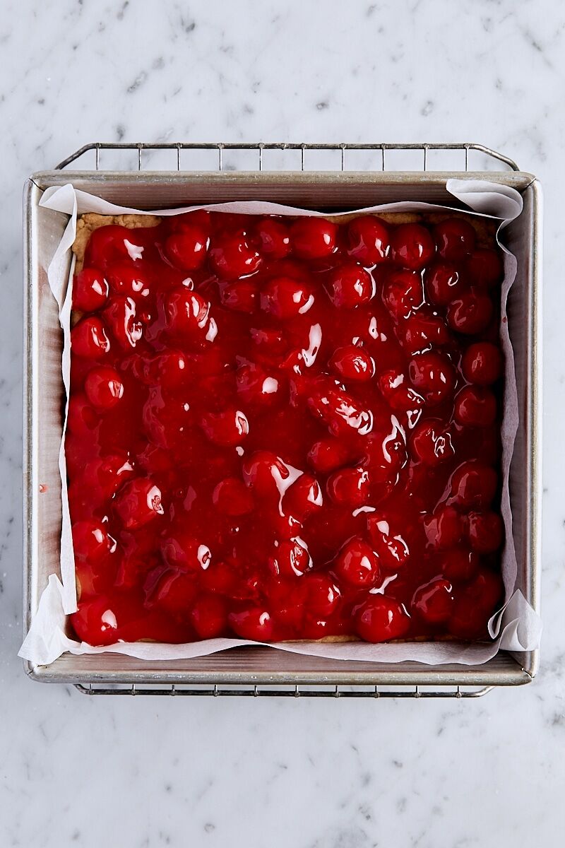 Cherry filling spooned over par-baked crust