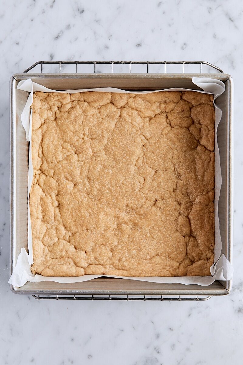 Par-baked crust in parchment-lined baking pan