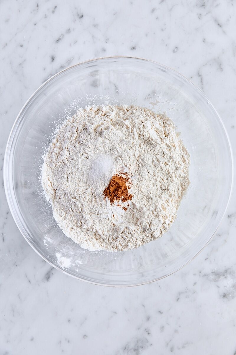 All-purpose flour, baking soda, salt, and cinnamon in glass bowl