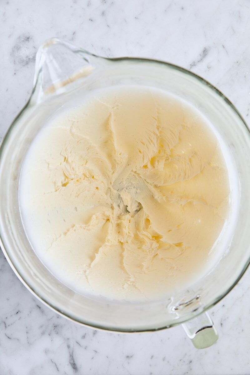 Butter and salt mixed together in glass mixer bowl
