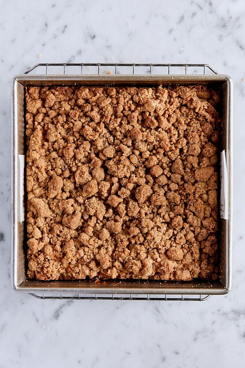 Baked crumb cake in parchment-lined pan