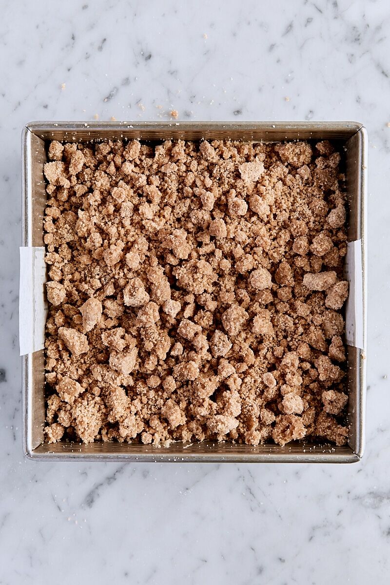 Cake batter topped with crumb topping in pan