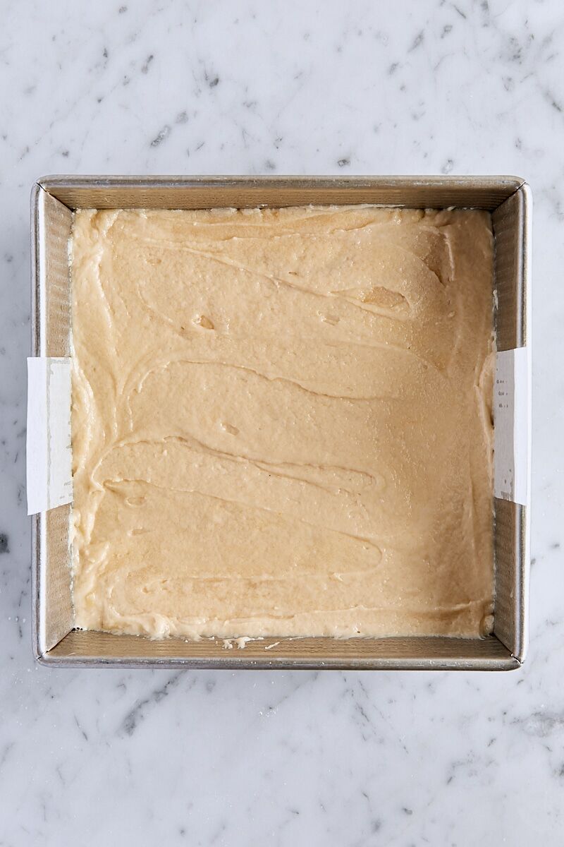 Crumb cake batter spread into 8-inch pan
