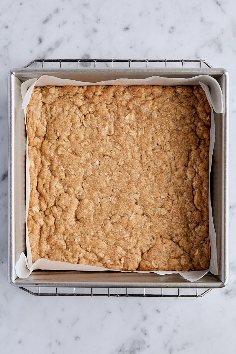 Par-baked crust in parchment-lined baking pan