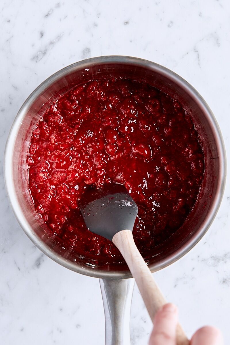 Raspberry filling brought to a boil in saucepan