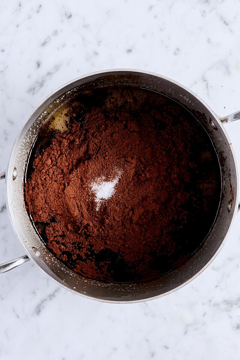 Cocoa powder and salt added to saucepan