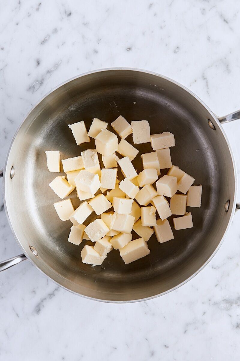 Cubed unsalted butter in saucepan