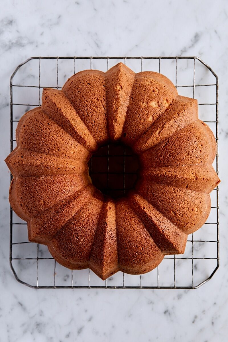 Baked lemon pound cake on cooling rack