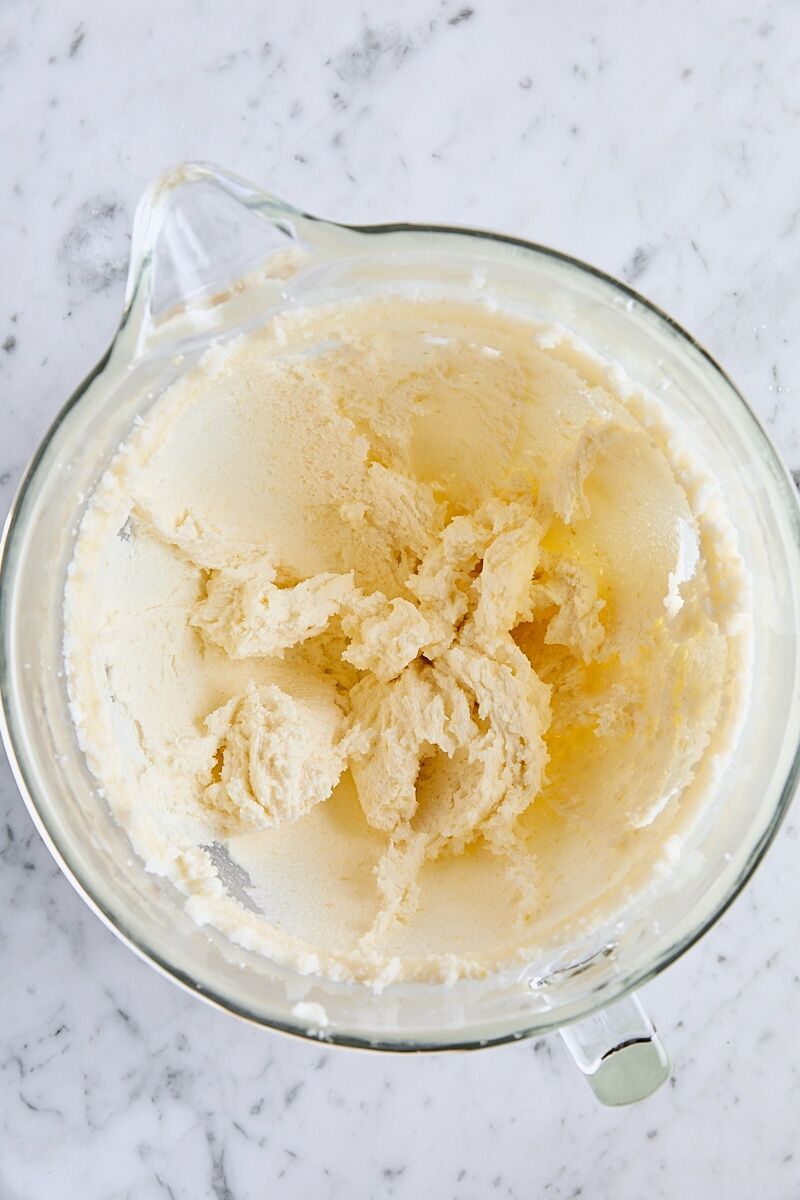 Butter and granulated sugar creamed together in glass mixer bowl