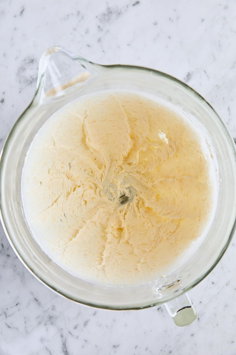 Butter, salt, and lemon zest mixed together in glass mixer bowl