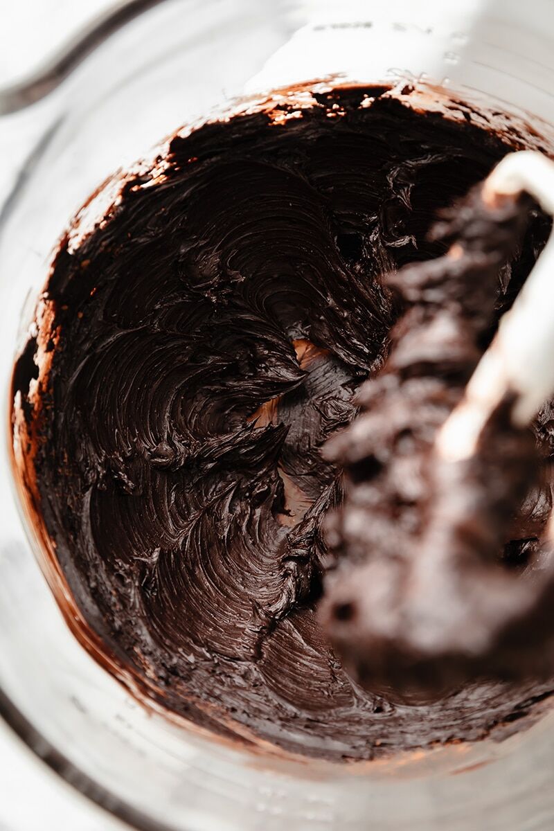 Sifted cocoa powder and vanilla extract fully incorporated