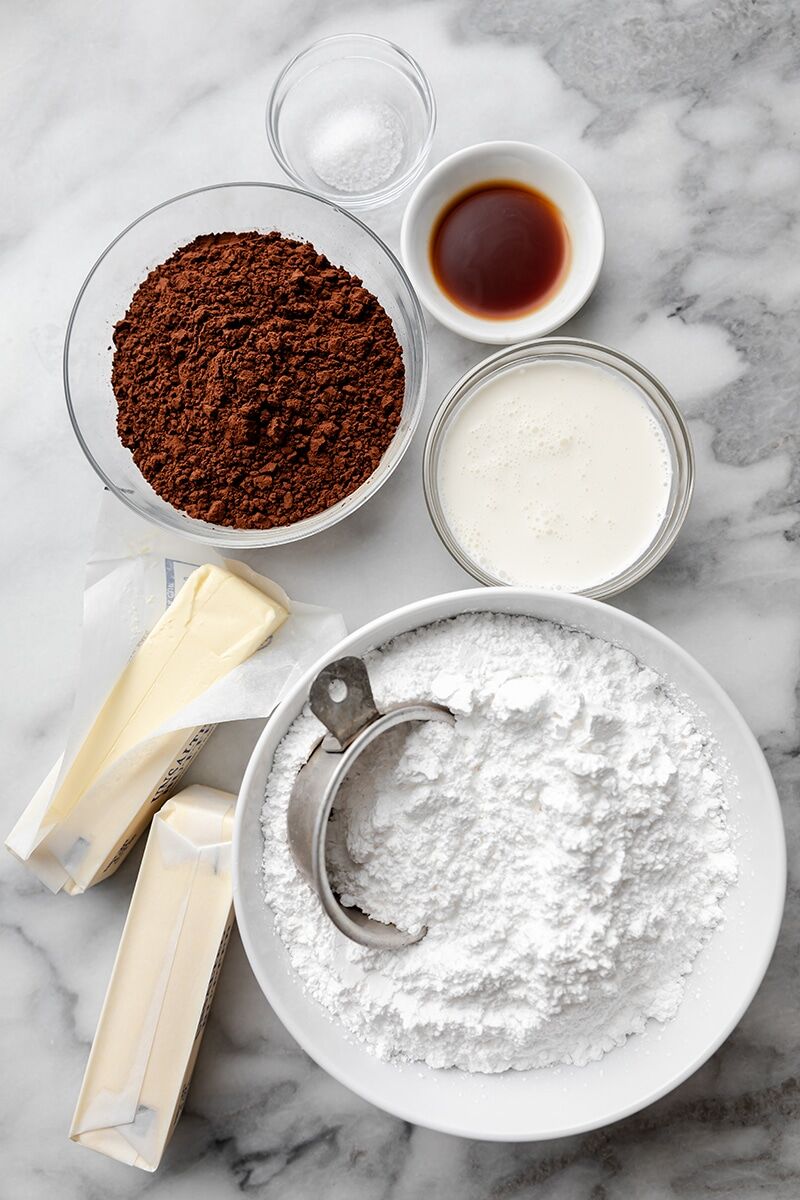 Softened butter, salt, cocoa powder, vanilla extract, powdered sugar, and heavy cream