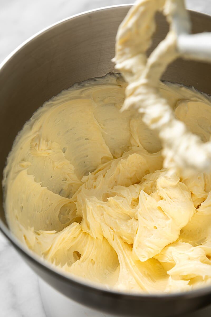 Butter, cream cheese, and salt combined in stainless steel mixer bowl