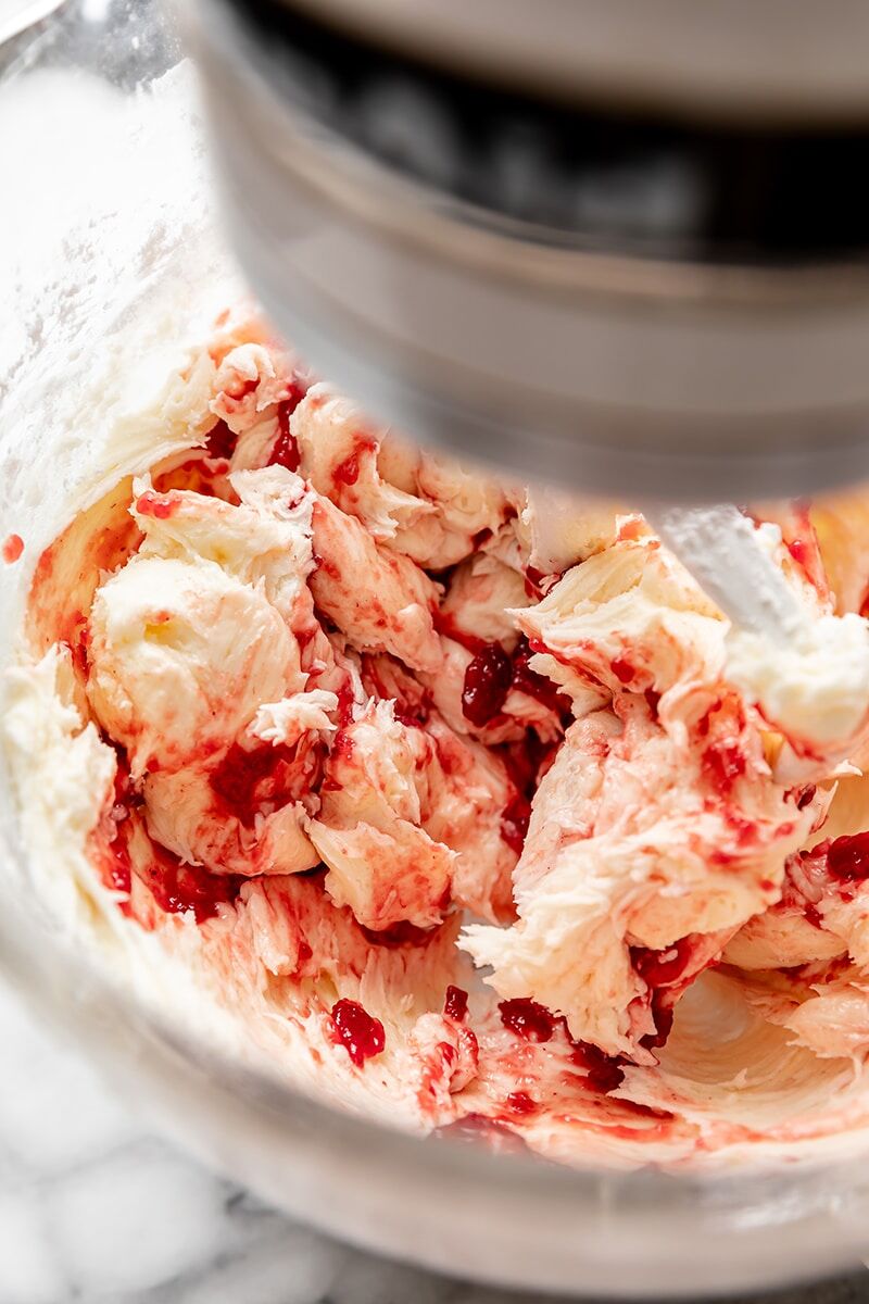 Raspberry preserves added to frosting mixture