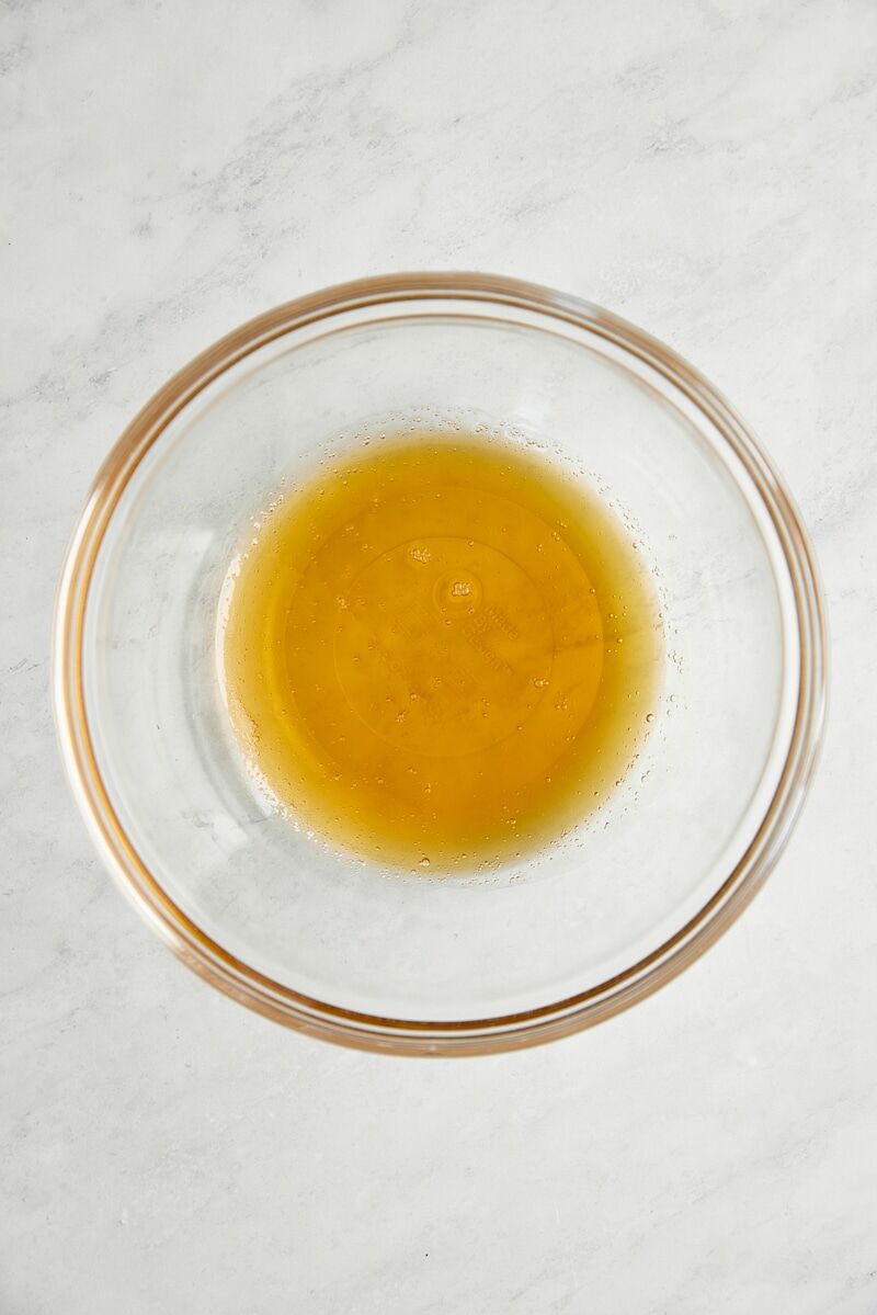 Honey in glass mixing bowl