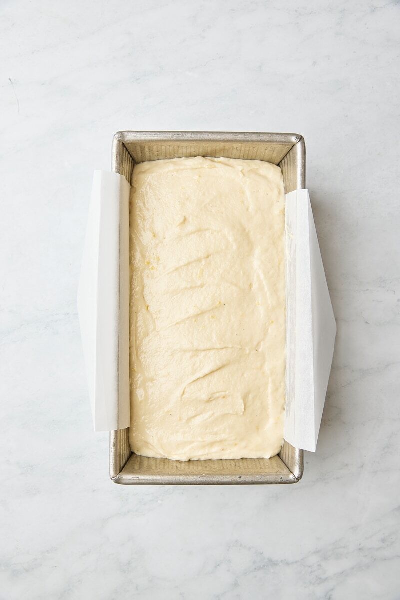 Cake batter in parchment-lined loaf pan