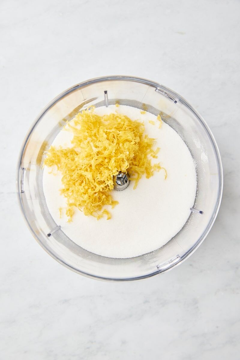 Lemon zest and granulated sugar in food processor