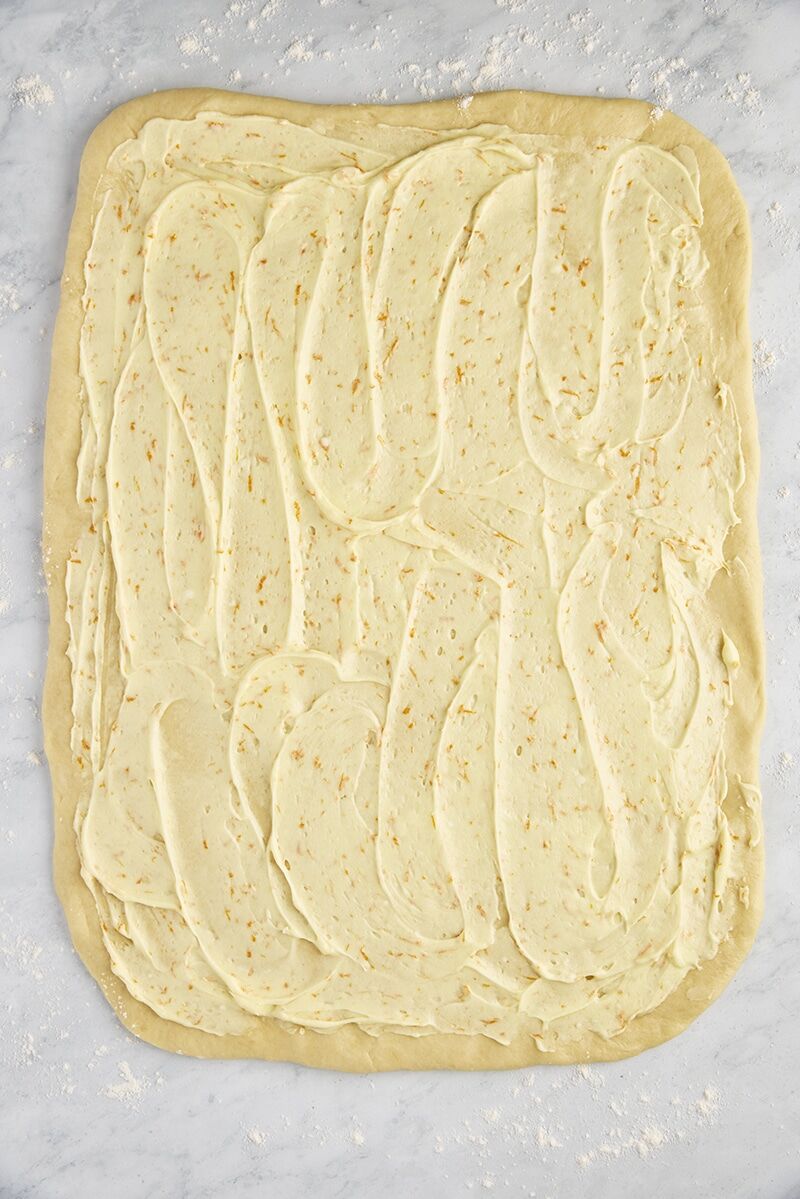 Dough rectangle topped with orange filling