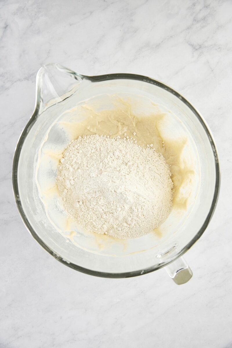 Remaining flour added to dough in glass mixer bowl