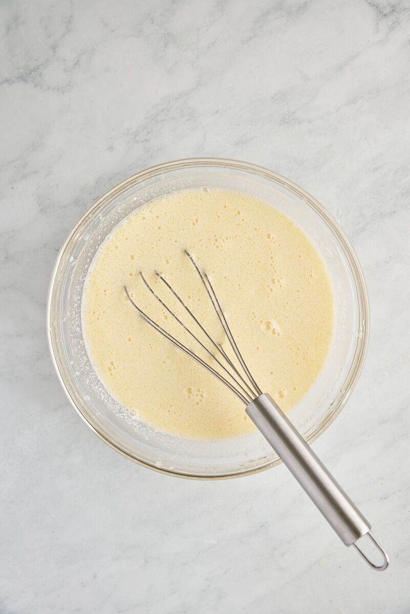 Wet ingredients whisked together in glass bowl