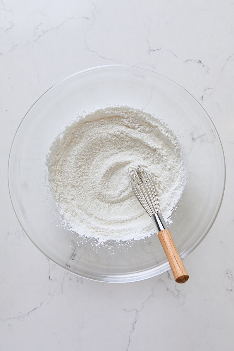 Granulated sugar, arrowroot starch, and salt whisked together in glass bowl