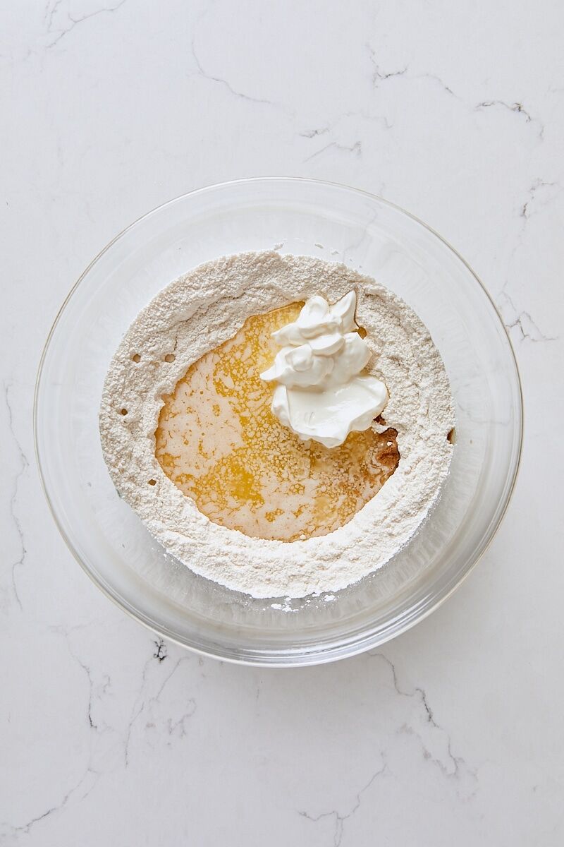 Melted butter, sour cream, and vanilla added to topping ingredients