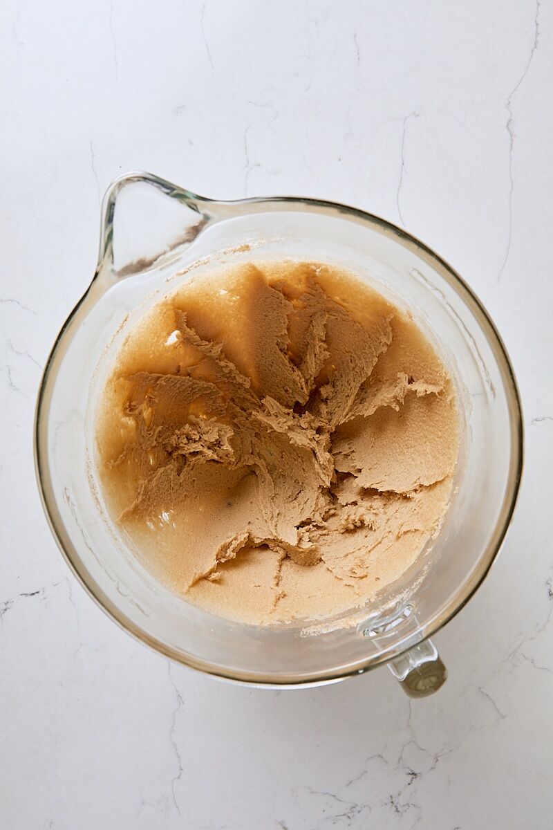 Butter and sugars mixed together until soft and creamy in glass mixer bowl