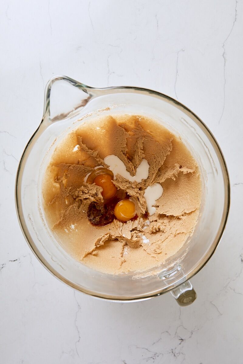 Egg, egg yolk, half and half, and vanilla extract added to dough