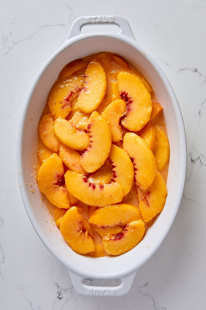 Peach filling spooned into baking dish