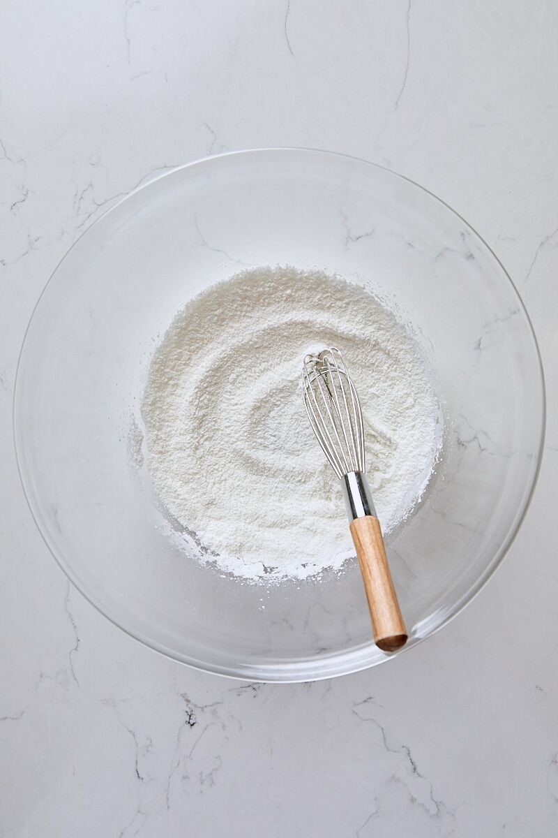 Granulated sugar, arrowroot starch, and salt whisked together in glass bowl