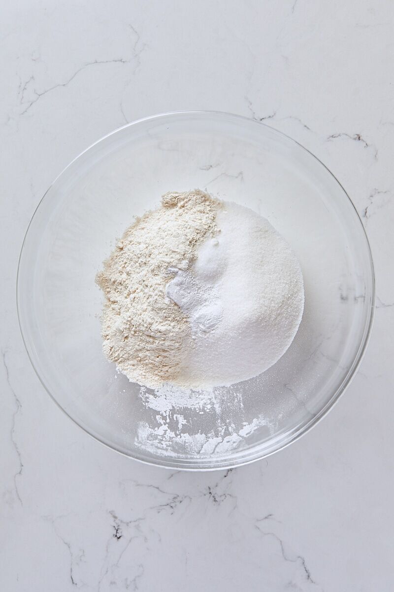 Flour, granulated sugar, baking powder, and salt in medium glass bowl