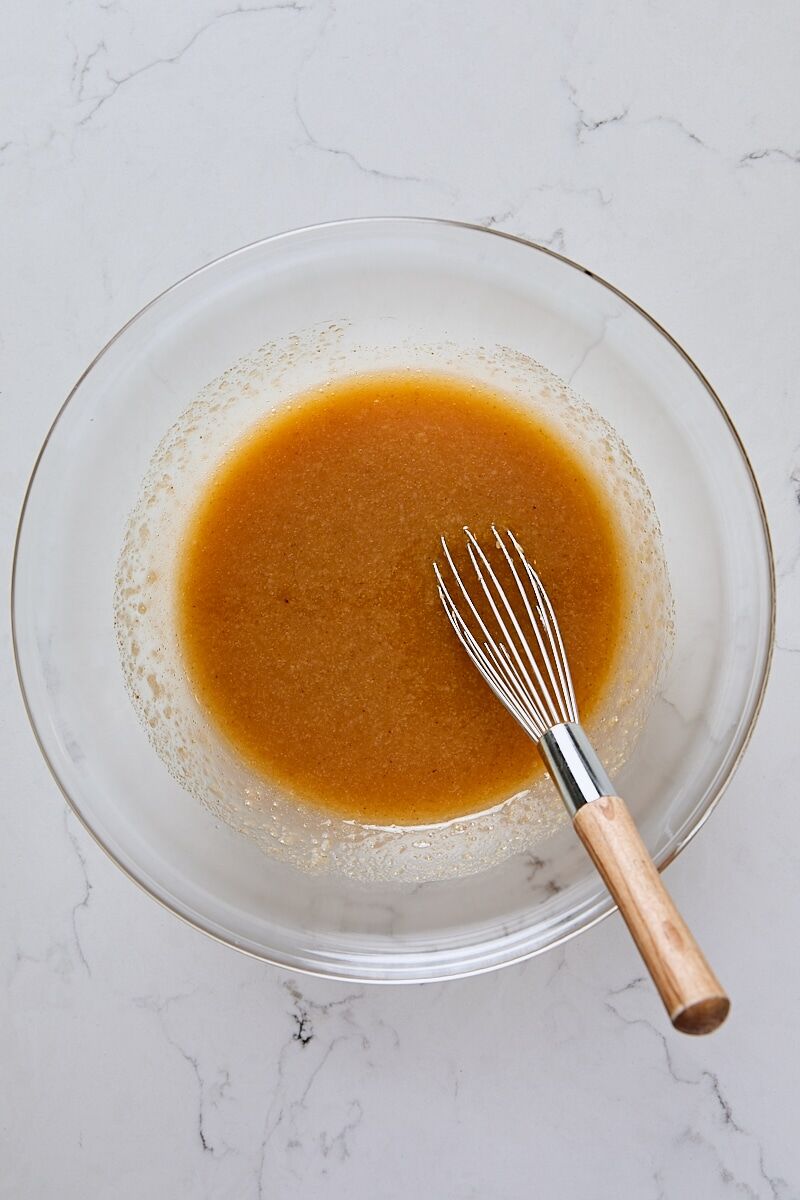 Wet ingredients whisked together in glass bowl