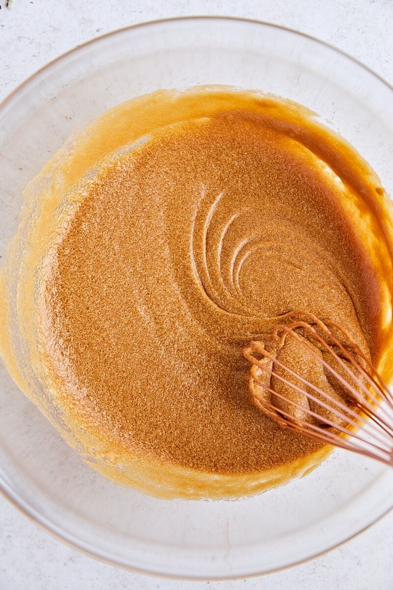 Wet ingredients for biscotti whisked in glass bowl