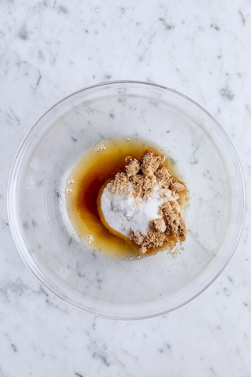 Brown butter, granulated sugar, and light brown sugar in glass bowl