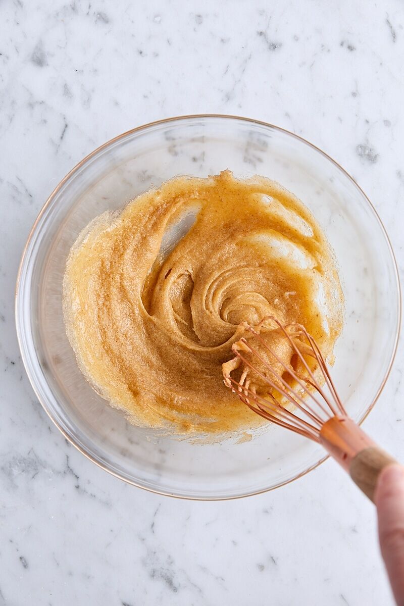 Wet ingredients whisked together in glass bowl