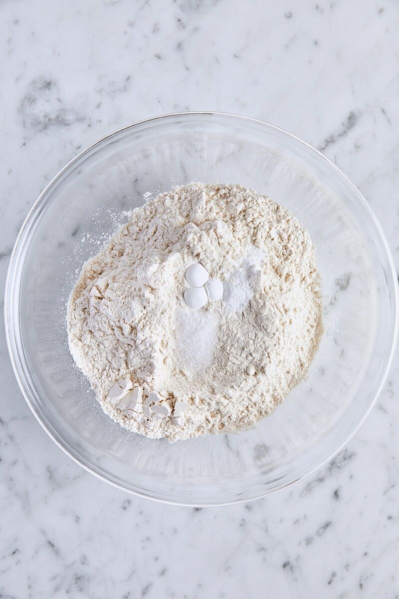 All-purpose flour, baking powder, baking soda, and salt in glass bowl