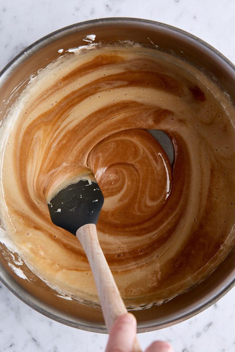 Marshmallow mixture swirled with salted caramel in large pan
