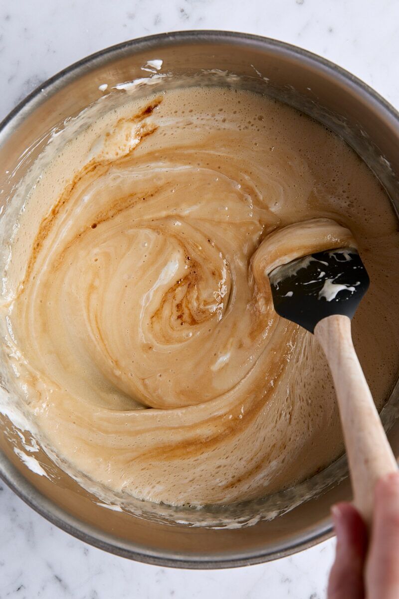 Vanilla extract and flaky salt added to marshmallow mixture in large pan