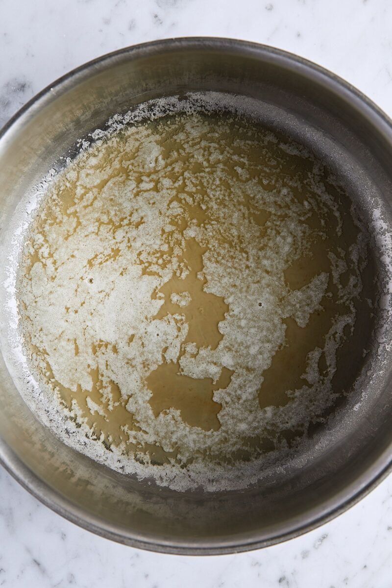 Melted butter in large pan