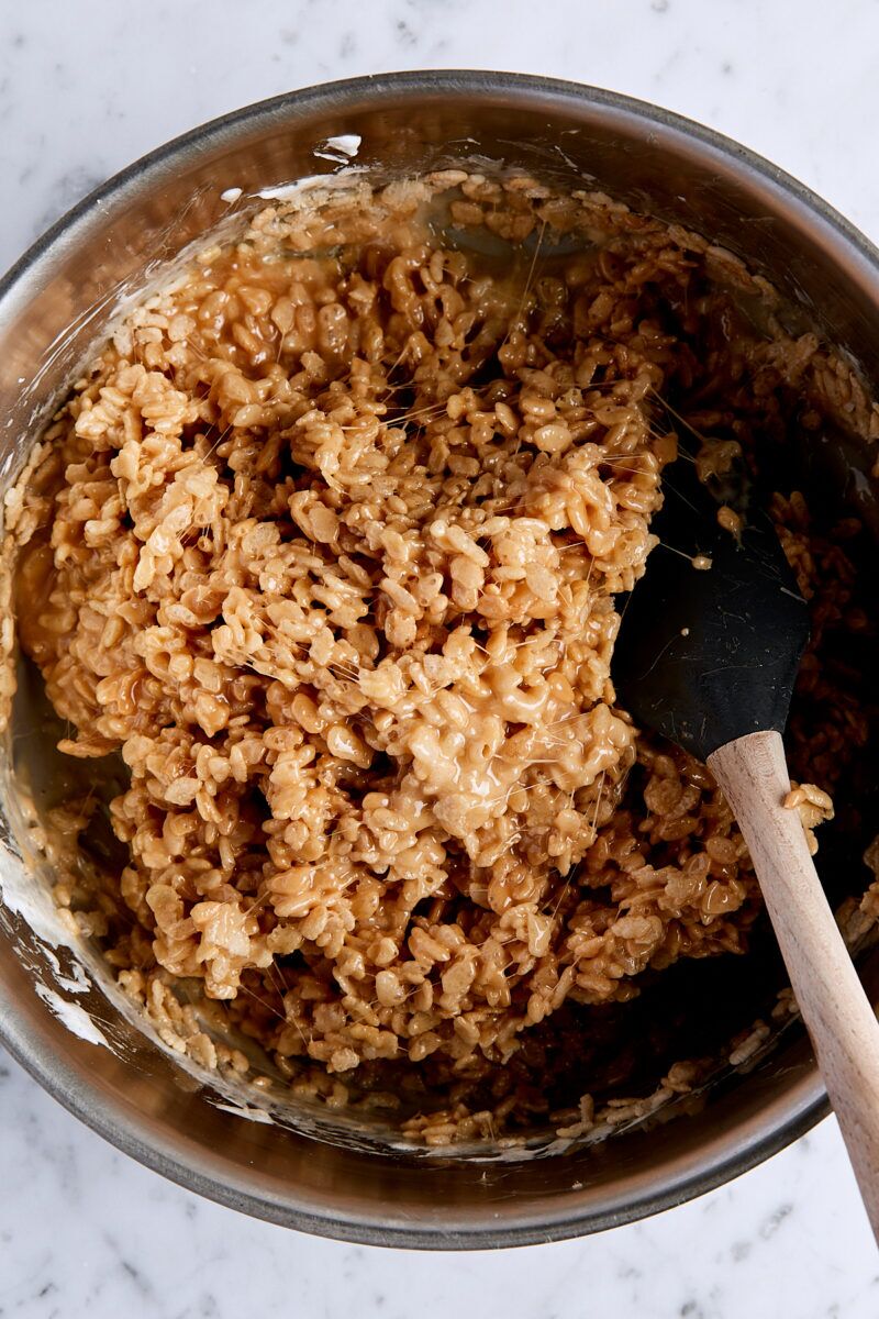 Mixed caramel rice krispie mixture in large pan