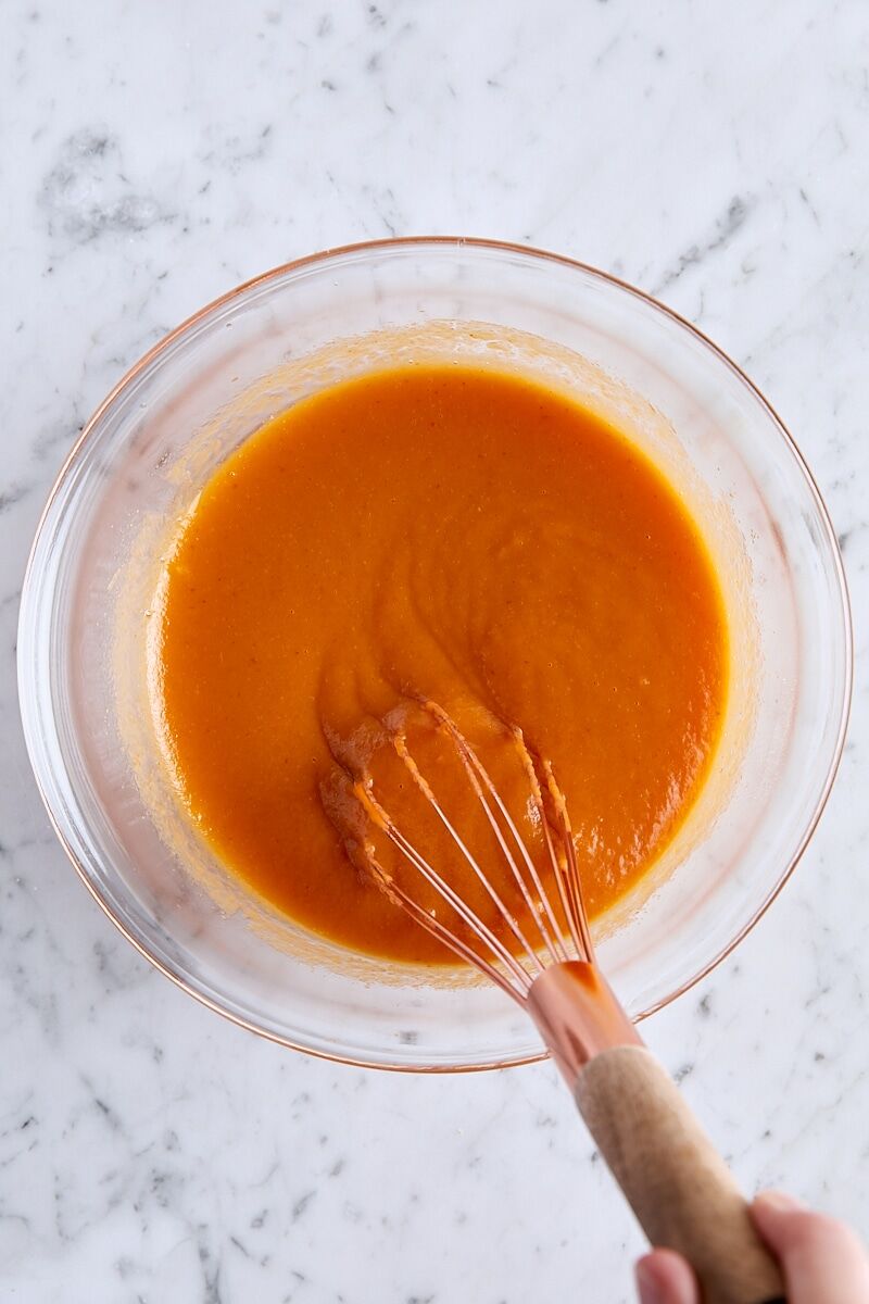 Wet ingredients whisked together in glass bowl