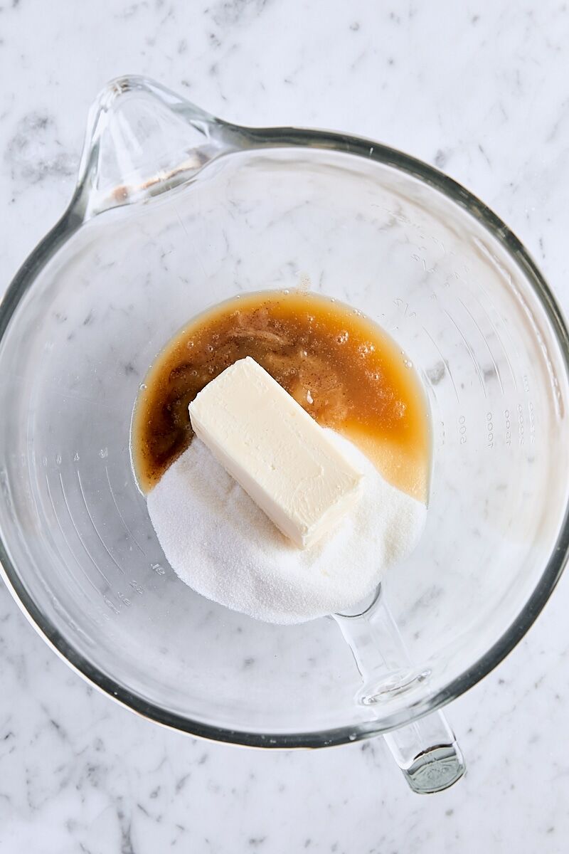 Room temperature butter, cooled brown butter, and granulated sugar in glass mixing bowl