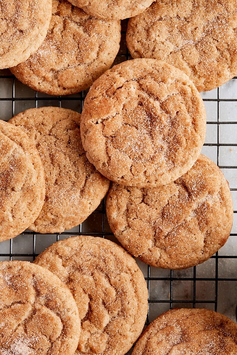 Baked snickerdoodle cookies on wire cooling rack